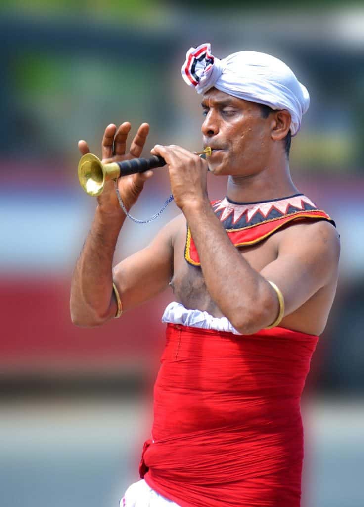 man playing brass instrument during daytime